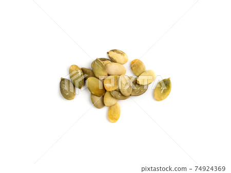 Pumpkin seeds pile isolated on white background top view Pumpkin seeds pile isolated on white background top view 74924369