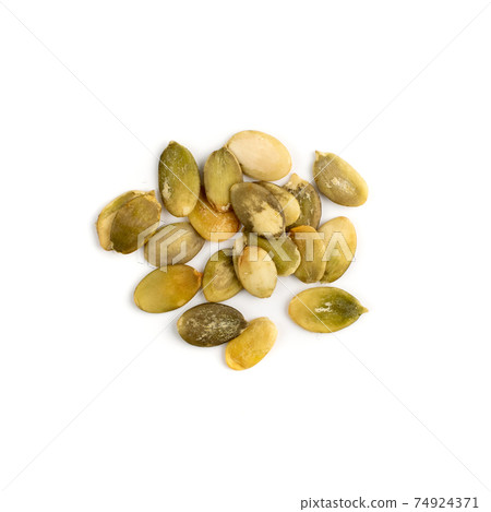 Pumpkin seeds pile isolated on white background top view Pumpkin seeds pile isolated on white background top view 74924371