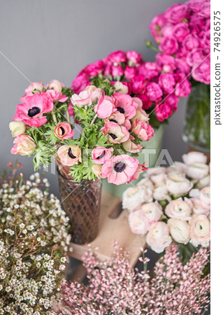 Set of white, pink and magenta flowers for Interior decorations. The work of the florist at a flower shop. Fresh cut flower. Set of white, pink and magenta flowers for Interior decorations. The work of the florist at a flower shop. Fresh cut flower. 74926575