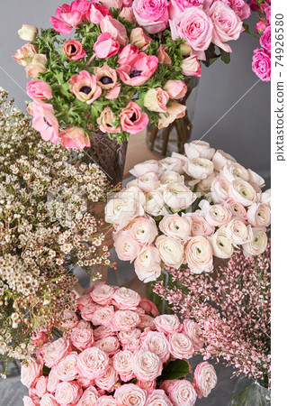 Set of white, pink and magenta flowers for Interior decorations. The work of the florist at a flower shop. Fresh cut flower. Set of white, pink and magenta flowers for Interior decorations. The work of the florist at a flower shop. Fresh cut flower. 74926580