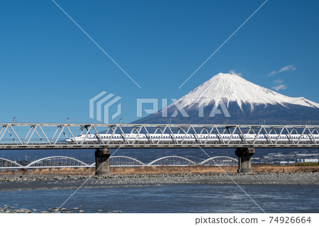 Tokaido Shinkansen N700s crossing the Fujikawa Bridge with Mt. Fuji in the background 74926664