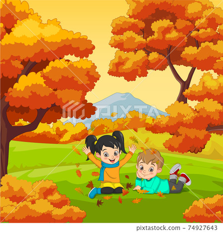 Cartoon Happy kids playing in autumn background 74927643