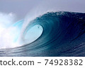 Tropical blue surfing wave 74928382