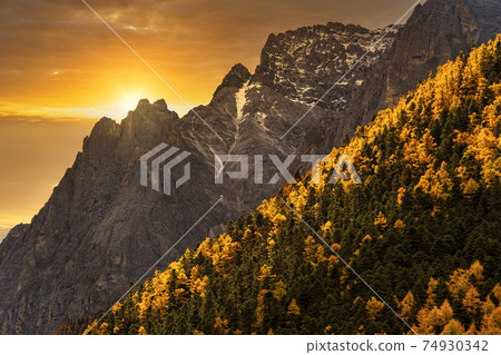 Scene of sunset at The mountain in autumn season in yading nature reserve, Daocheng County, southwest of Sichuan Province, China.travel destination and tourism,famous place and landmark concept. Scene of sunset at The mountain in autumn season in yading nature reserve, Daocheng County, southwest of Sichuan Province, China.travel destination and tourism,famous place and landmark concept. 74930342