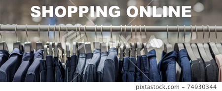 Shopping online text over Banner, web page of clothes rack in glasses fashion shop at shopping department store for display, copy space and paranomic ratio, business fashion and advertisement concept Shopping online text over Banner, web page of clothes rack in glasses fashion shop at shopping department store for display, copy space and paranomic ratio, business fashion and advertisement concept 74930344
