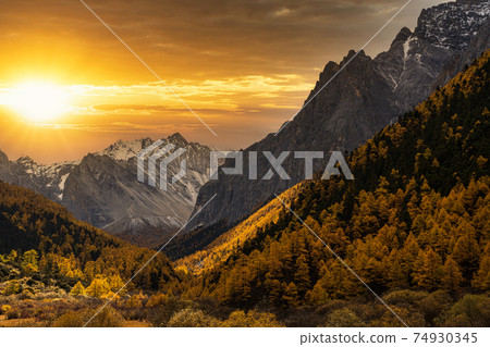 Scene of sunset at The mountain in autumn season in yading nature reserve, Daocheng County, southwest of Sichuan Province, China.travel destination and tourism,famous place and landmark concept. Scene of sunset at The mountain in autumn season in yading nature reserve, Daocheng County, southwest of Sichuan Province, China.travel destination and tourism,famous place and landmark concept. 74930345