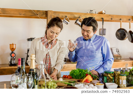 Nesting, home time, senior couple cooking 74932563