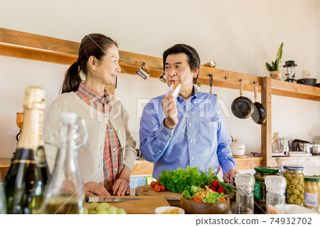 Nesting, home time, senior couple cooking 74932702