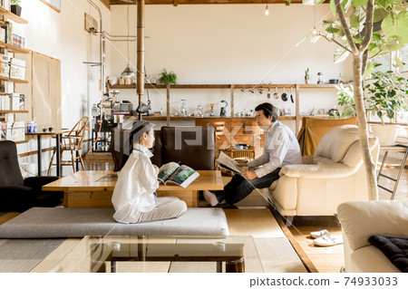 Nesting / House time: Senior couple relaxing in a renovated house 74933033