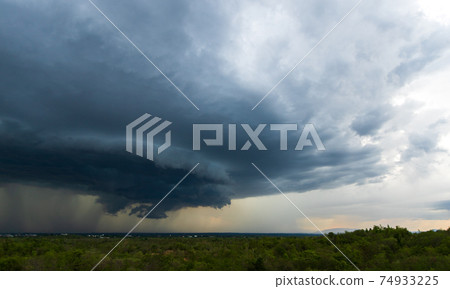 Storm clouds with the rain. Nature Environment Dark huge cloud sky black stormy cloud 74933225