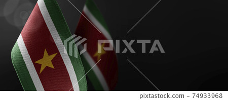 Small national flags of the Suriname on a dark background Small national flags of the Suriname on a dark background 74933968