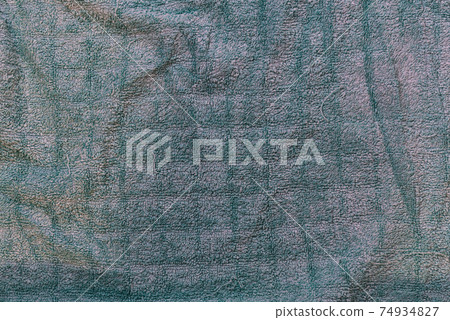 Old towel texture. The towel is wrinkled and washed, uneven color. background, texture Old towel texture. The towel is wrinkled and washed, uneven color. background, texture 74934827