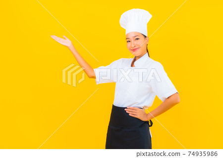 Portrait beautiful young asian woman in chef or cook uniform with hat 74935986