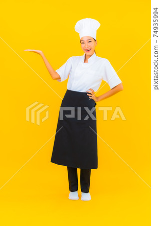 Portrait beautiful young asian woman in chef or cook uniform with hat 74935994