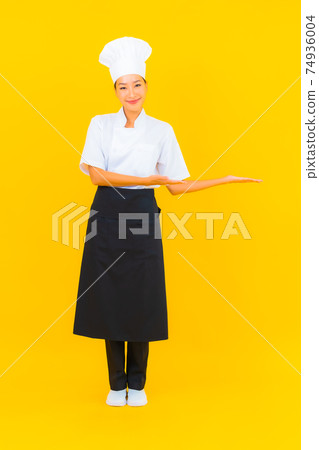 Portrait beautiful young asian woman in chef or cook uniform with hat 74936004