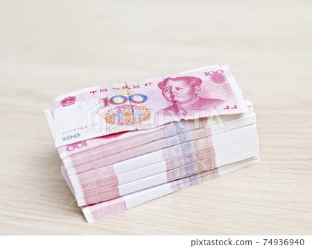 stack of chinese yuan on table stack of chinese yuan on table 74936940