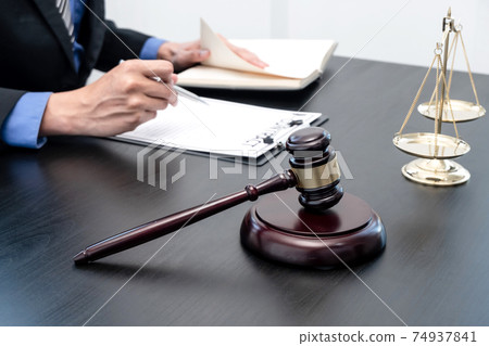 Professional male lawyers work at a law office There are scales, Scales of justice, judges gavel, and litigation documents. Concepts of law and justice Professional male lawyers work at a law office There are scales, Scales of justice, judges gavel, and litigation documents. Concepts of law and justice 74937841
