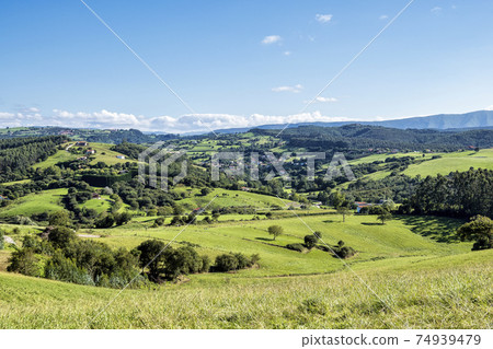 Green hills and meadows nearby the town of Comillas, cantabria, Spain Green hills and meadows nearby the town of Comillas, cantabria, Spain 74939479