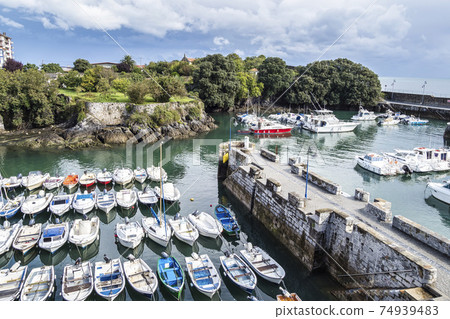 View of the Port of Mundaka in the Basque country, Spain. Mundaka is famous for its surfing. View of the Port of Mundaka in the Basque country, Spain. Mundaka is famous for its surfing. 74939483