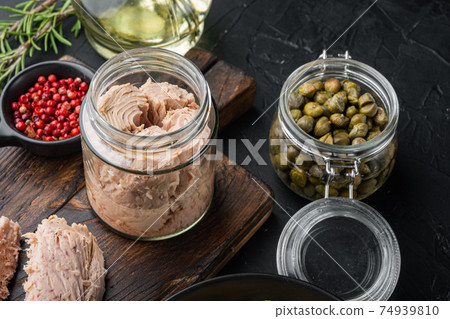 Carlofortina pasta with tuna ingredients, on black background 74939810