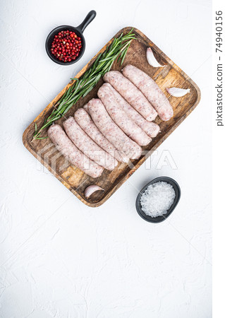 Traditional raw sausages, flat lay with space for text, on white background Traditional raw sausages, flat lay with space for text, on white background 74940156