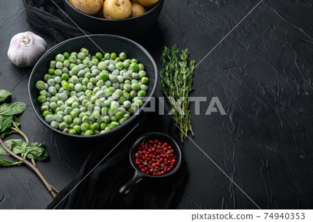 Green peas, on black textured background with copy space Green peas, on black textured background with copy space 74940353
