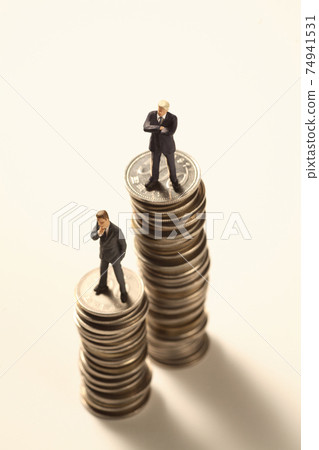 Symbolic image of financial business using coins and figures 74941531