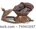 Dates on a bronze plate isolated 74941697