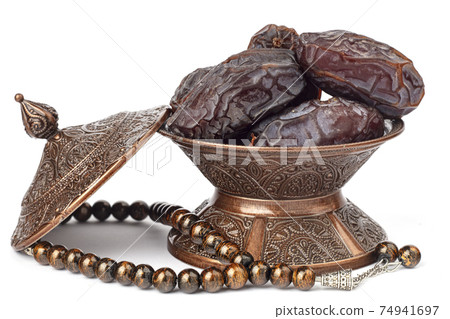 Dates on a bronze plate isolated Dates on a bronze plate isolated 74941697