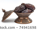 Dates on a bronze plate isolated 74941698