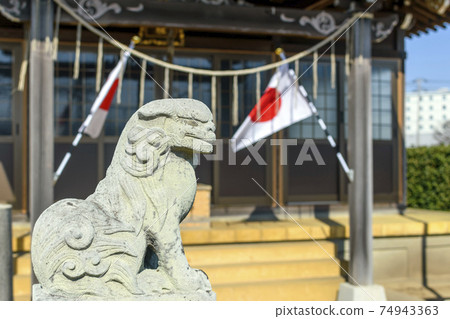 Sobataka Shrine near Narita Airport: Komainu and the Japanese flag Sobataka Shrine near Narita Airport: Komainu and the Japanese flag 74943363
