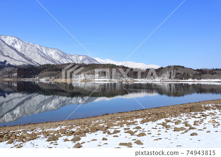 Lake Aoki and Shirouma Mountains waiting for spring Lake Aoki and Shirouma Mountains waiting for spring 74943815