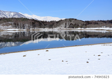 Lake Aoki and Shirouma Mountains waiting for spring Lake Aoki and Shirouma Mountains waiting for spring 74943823
