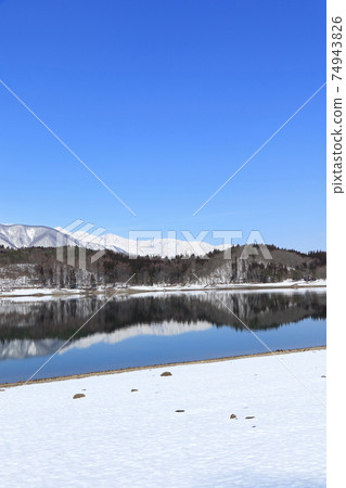 Lake Aoki and Shirouma Mountains waiting for spring Lake Aoki and Shirouma Mountains waiting for spring 74943826