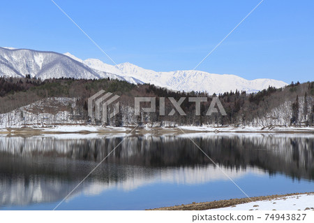 Lake Aoki and Shirouma Mountains waiting for spring Lake Aoki and Shirouma Mountains waiting for spring 74943827