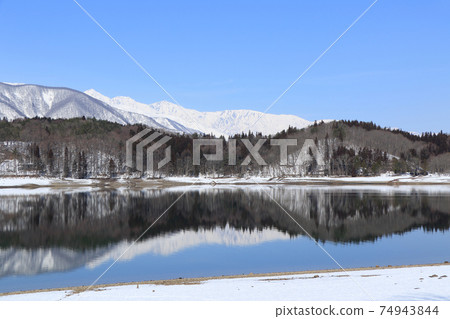 Lake Aoki and Shirouma Mountains waiting for spring Lake Aoki and Shirouma Mountains waiting for spring 74943844