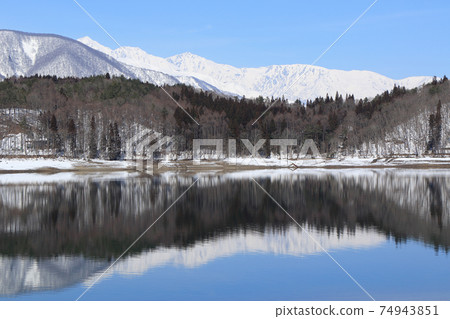 Lake Aoki and Shirouma Mountains waiting for spring Lake Aoki and Shirouma Mountains waiting for spring 74943851