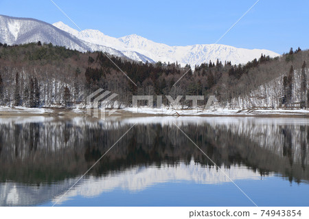 Lake Aoki and Shirouma Mountains waiting for spring Lake Aoki and Shirouma Mountains waiting for spring 74943854