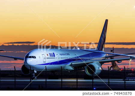 Aircraft in the sunrise (Triple Seven) 74943870