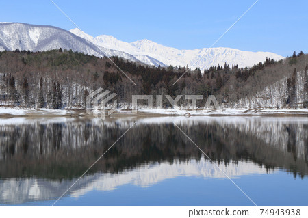 Lake Aoki and Shirouma Mountains waiting for spring Lake Aoki and Shirouma Mountains waiting for spring 74943938
