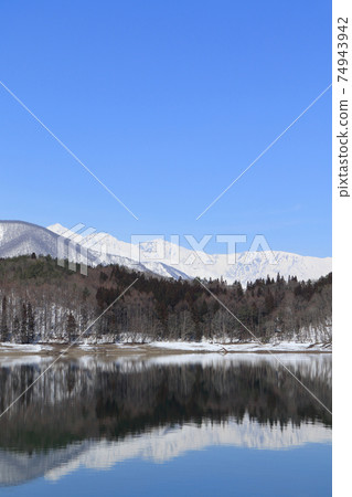 Lake Aoki and Shirouma Mountains waiting for spring Lake Aoki and Shirouma Mountains waiting for spring 74943942