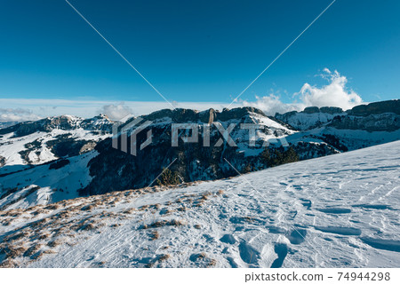 beautiful sunny snowy mountain landscape on Ebenalp in Appenzell 74944298