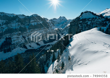 beautiful sunny snowy mountain landscape on Ebenalp in Appenzell 74944358