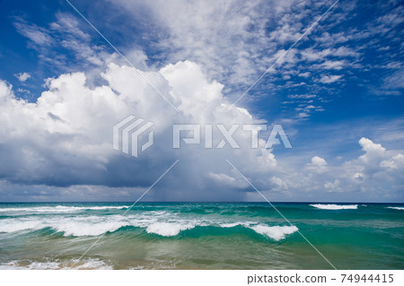 Seascape, waves with white foam on top against the background of blue water. Seascape, waves with white foam on top against the background of blue water. 74944415