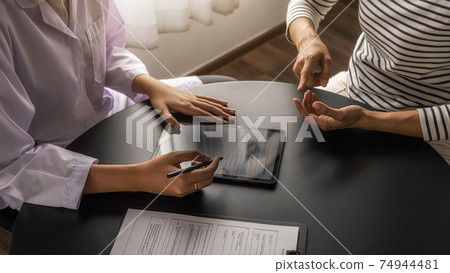 Psychiatrist or professional psychologist consulting on diagnostic examination disease or mental illness in medical clinic or hospital mental. Medical and Healthy service concept. 74944481