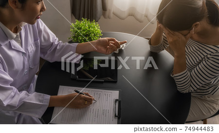 Psychiatrist or professional psychologist consulting on diagnostic examination disease or mental illness in medical clinic or hospital mental. Medical and Healthy service concept. 74944483