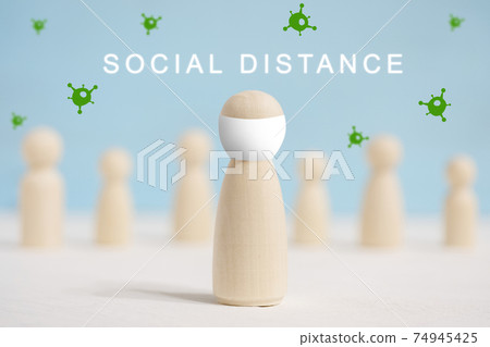 Wooden figures of man in the center and people stand apart from each other. 74945425