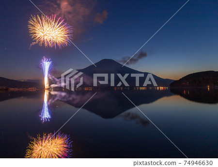 Mt. Fuji and fireworks reflected in Lake Yamanaka in winter Mt. Fuji and fireworks reflected in Lake Yamanaka in winter 74946630
