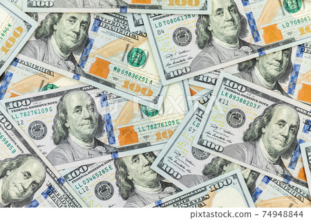 Texture with US dollars. Background of one hundred dollar bills. Texture with US dollars. Background of one hundred dollar bills. 74948844