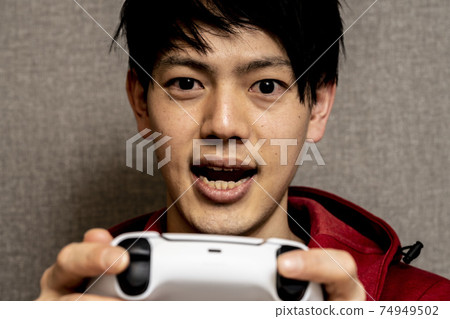 Young man addicted to video games, young Asian man with sleeping habits, young man crazy about games, Young man addicted to video games, young Asian man with sleeping habits, young man crazy about games, 74949502